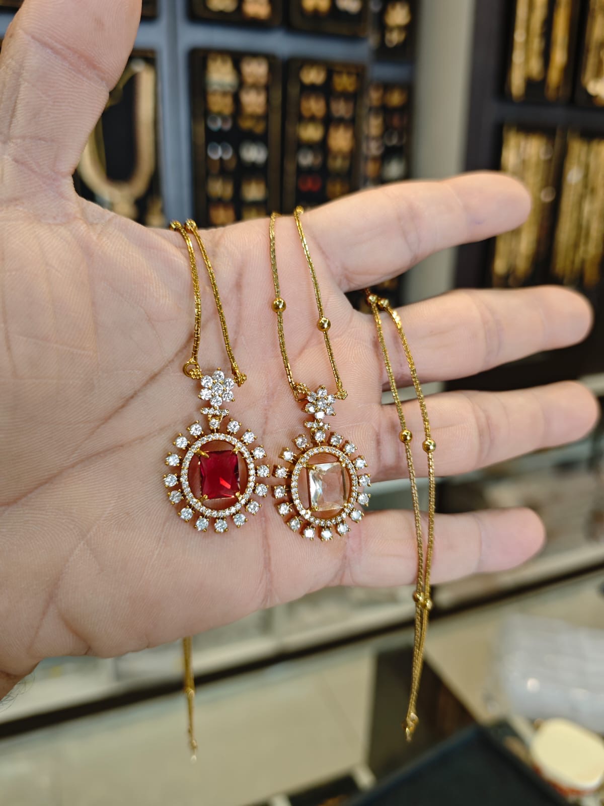 AD stones 2grm gold polish 2 years warranty pendant with 18 inches short chain set.
