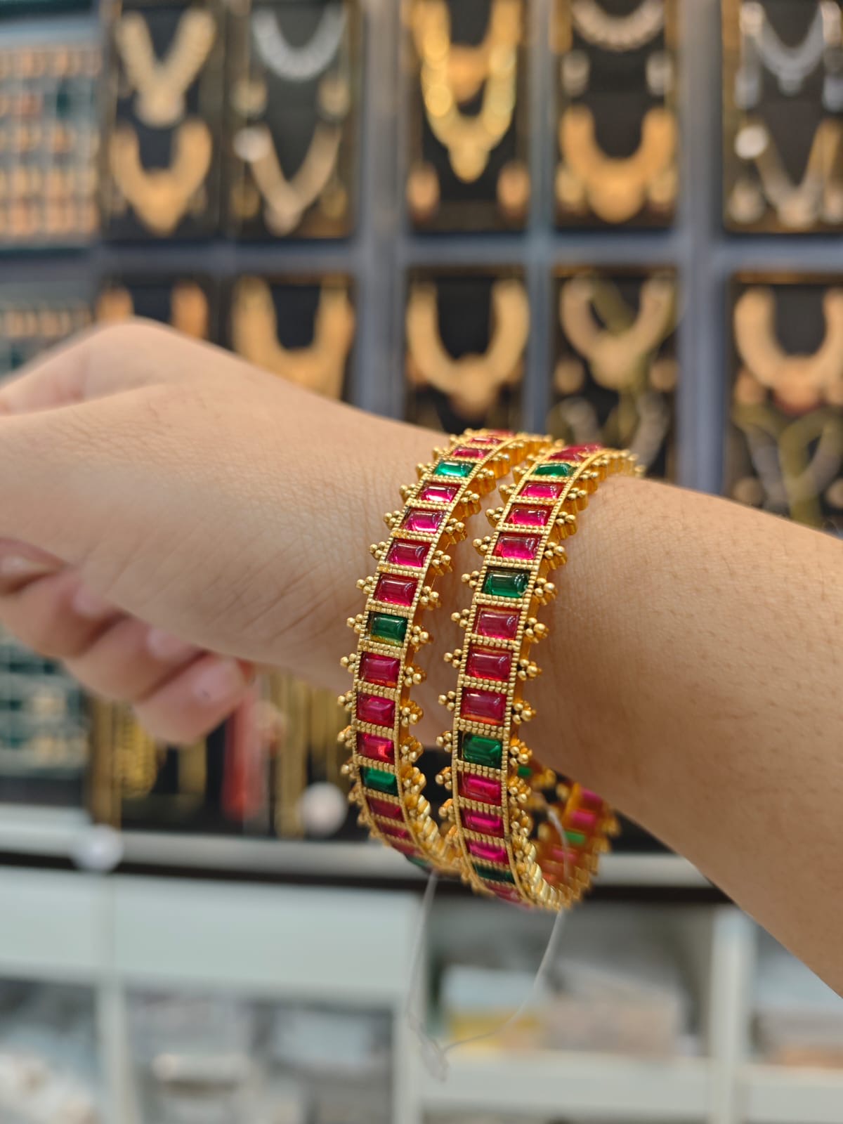 Matt gold polish stones bangles set.