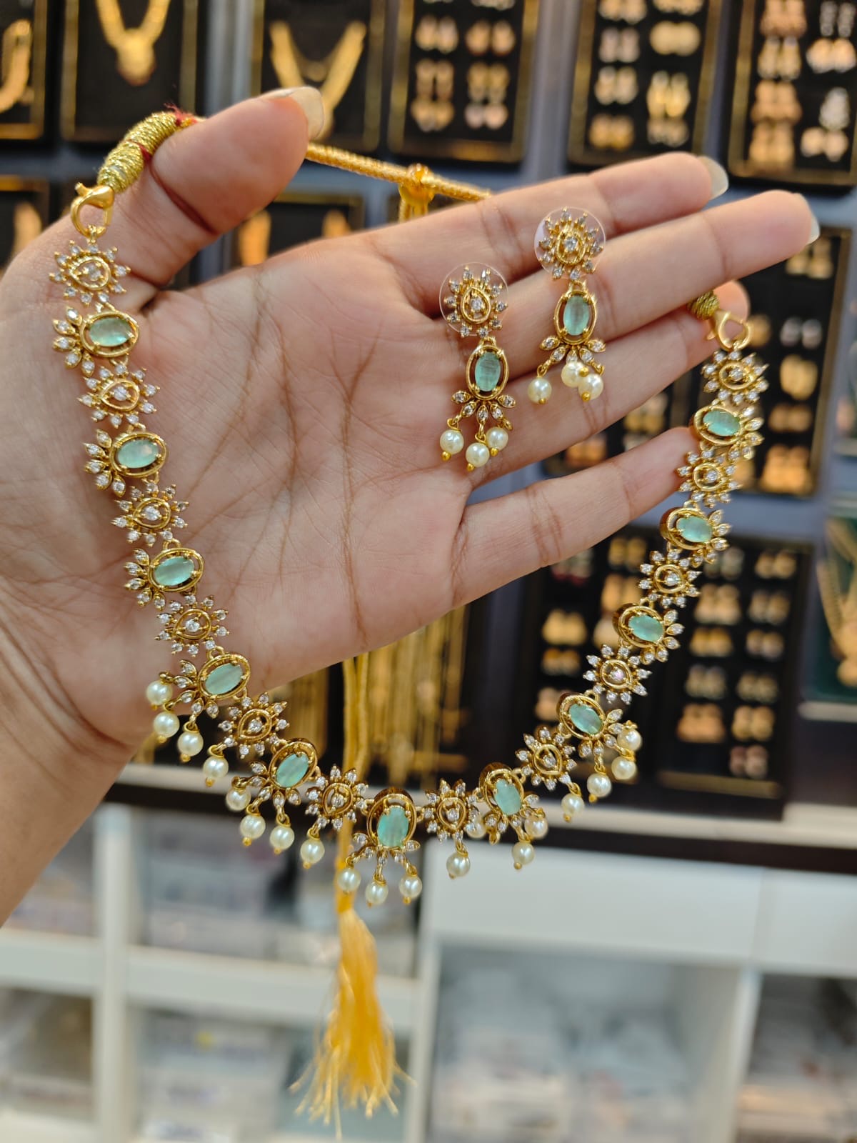 AD stones gold polish 2 years warranty bridal necklace set.